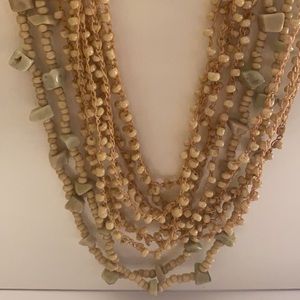 Lovely natural looking long necklace tan